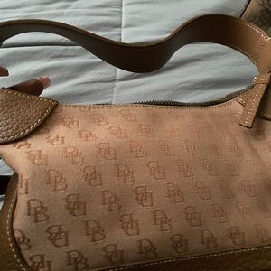 Two tone brown Dooney and Bourke hand bag.